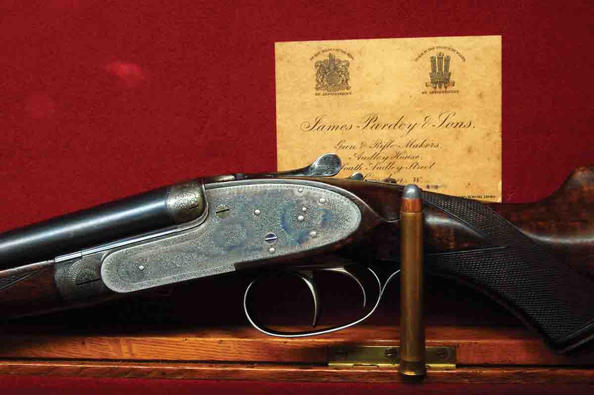 A .400 Purdey Straight (3) is shown in its original trunk case.